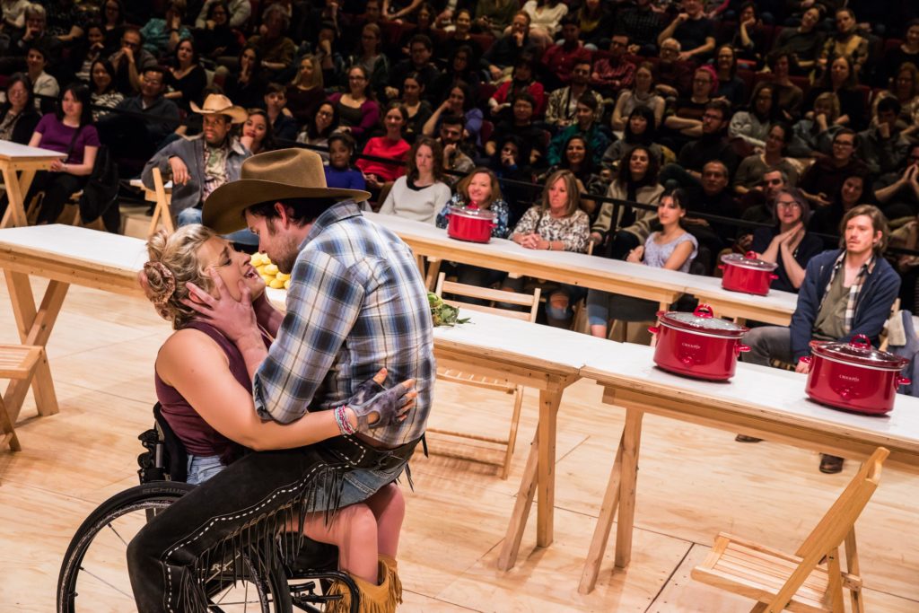 James Davis as Will Parker sits on Ali Stroker as Ado Annie's lap in "Oklahoma!" on Broadway