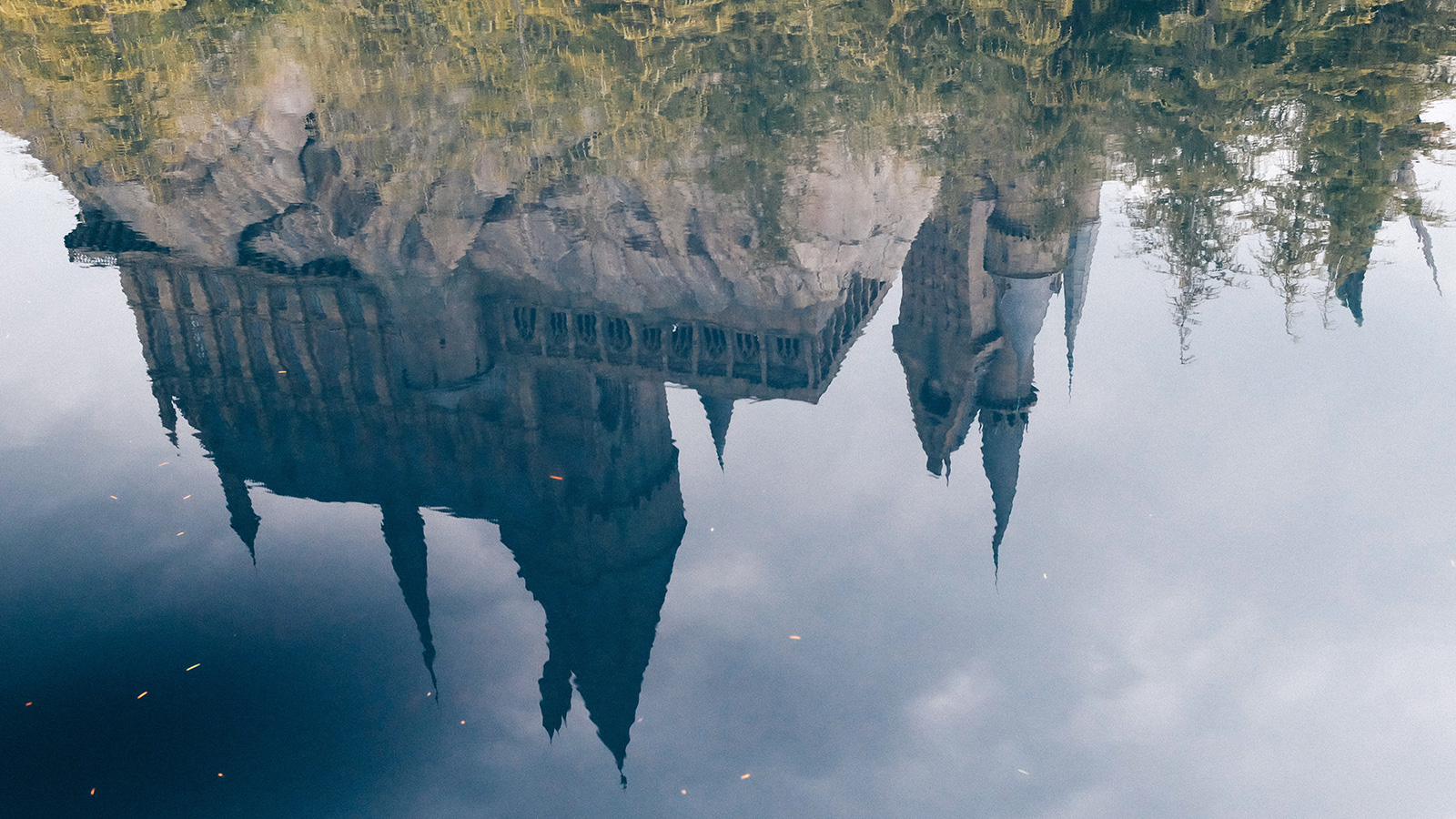 A reflection of Hogwarts Castle in a body of water.